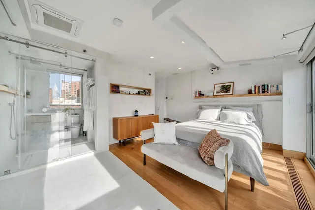 a kitchen with stainless steel appliances granite countertop a stove and a wooden floors