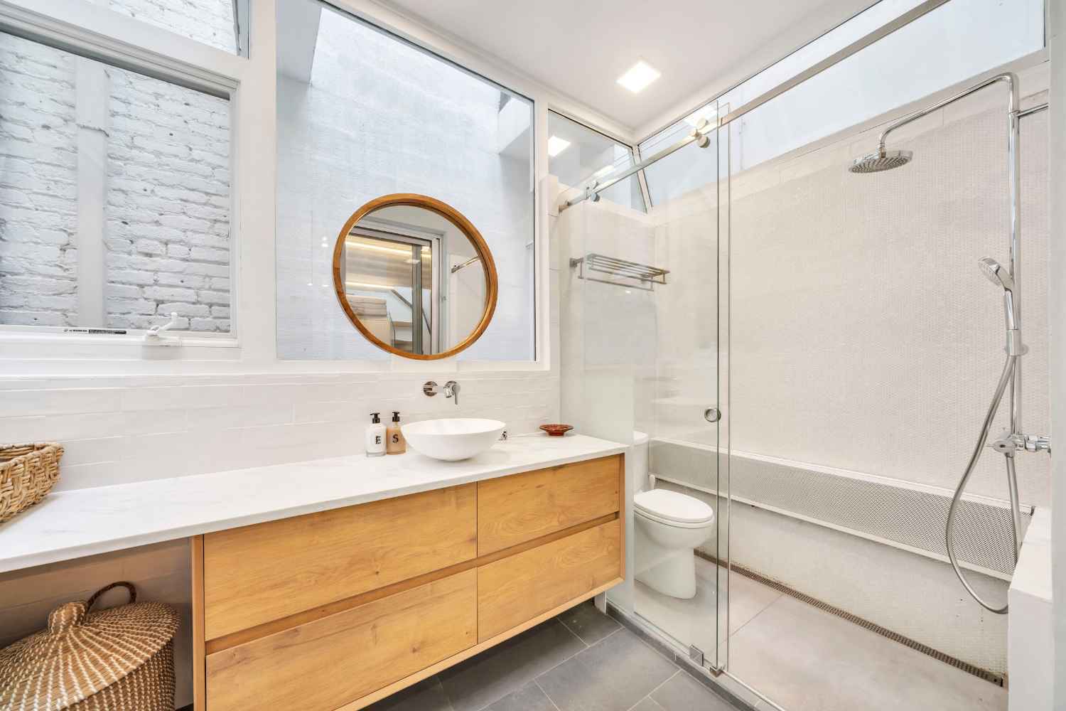 Undisclosed Address Manhattan, NY 10012 - Photo 15 of 36 a bathroom with a sink a toilet and shower