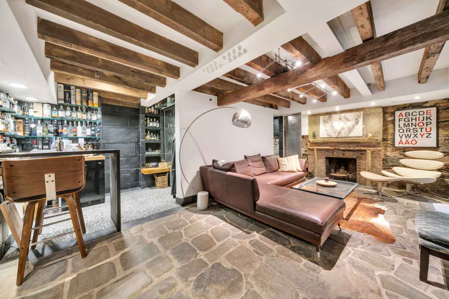 Undisclosed Address Manhattan, NY 10012 - Photo 16 of 36 a living room with furniture and a fireplace