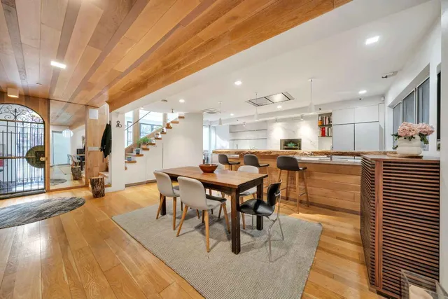 a view of living room with furniture and wooden floor