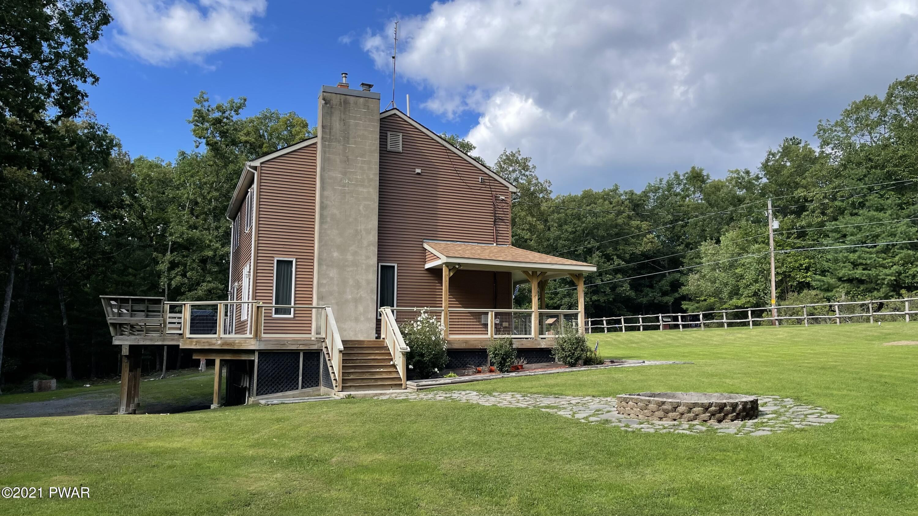 116 Cabin Ridge Road Hawley, PA 18428 - Photo 64 of 65 Wrap around porch w/ walkout to fire pit