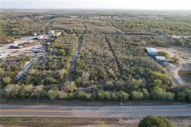 an aerial view of house with yard