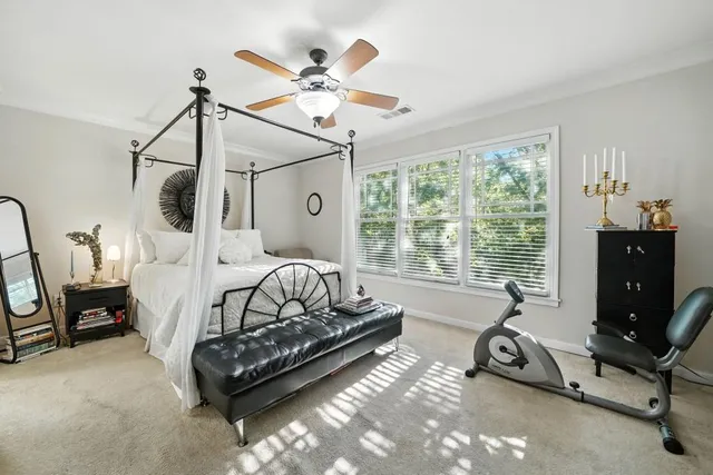 a bedroom with furniture and a window