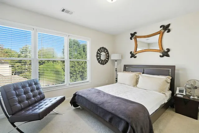 a bedroom with bed and window