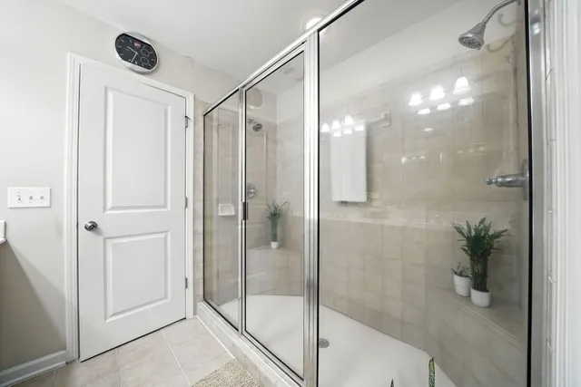 a bathroom with a shower and a sink