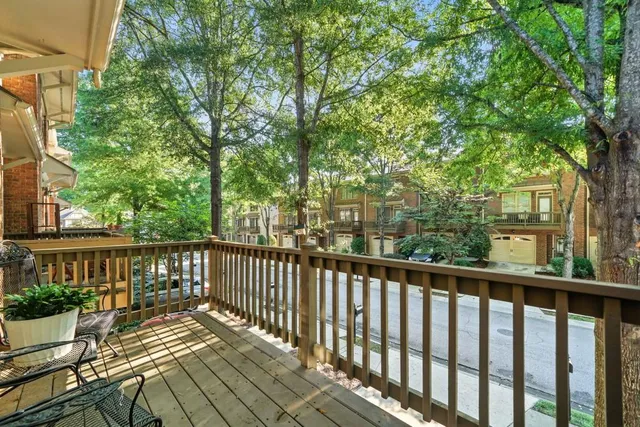 a view of a two chairs with wooden fence