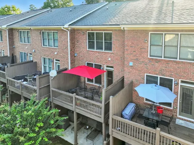 a view of a porch with potted plants