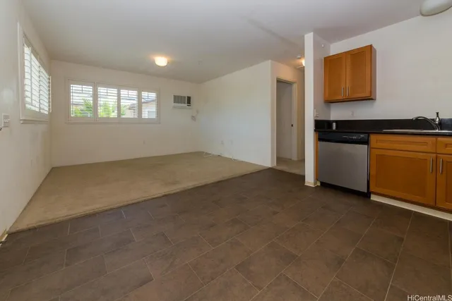 a view of a kitchen with a sink dishwasher and a microwave
