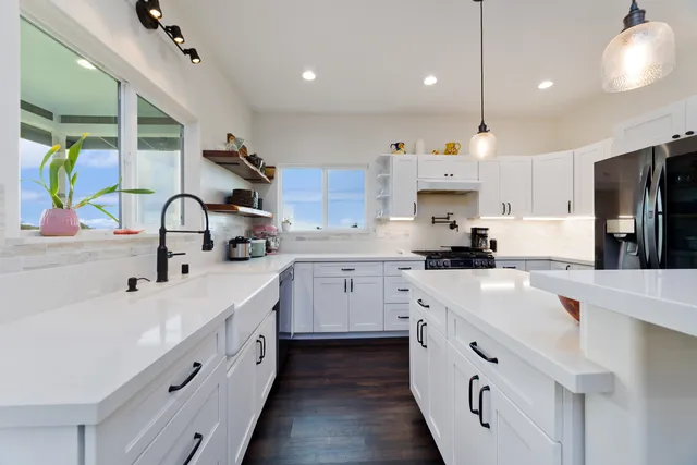 a bathroom with a sink vanity and a mirror