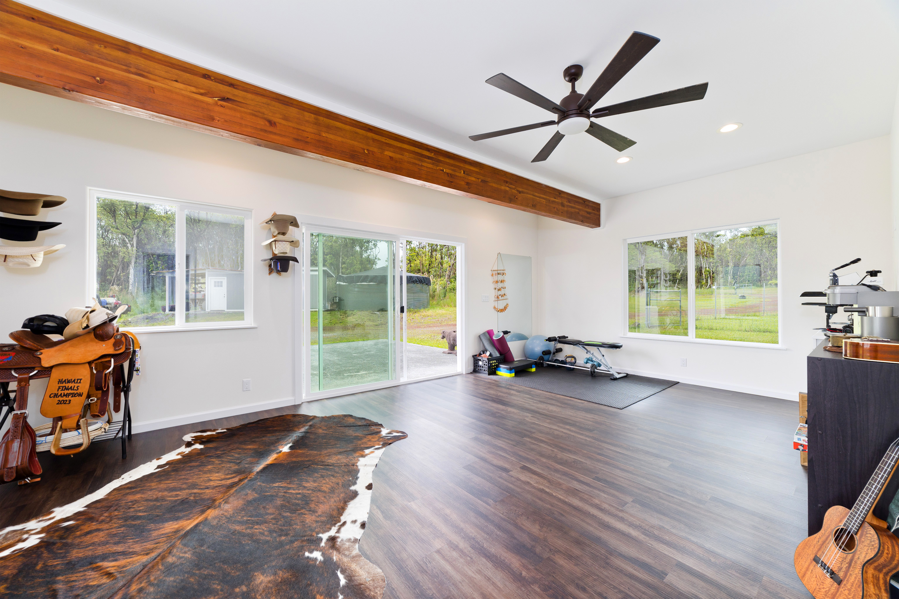 18-7970 North Lauko Road Mountain View, HI 96771 - Photo 14 of 30 a view of a livingroom with hardwood floor and a ceiling fan