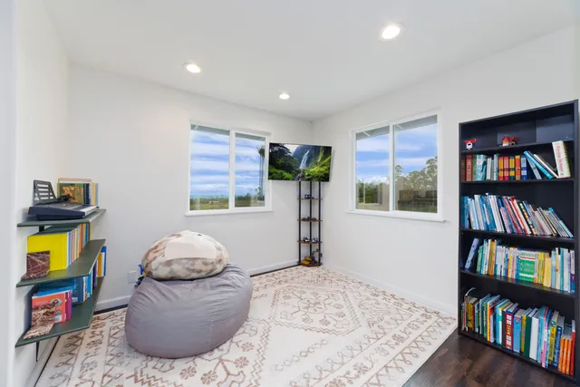 an aerial view of a house with a ocean view