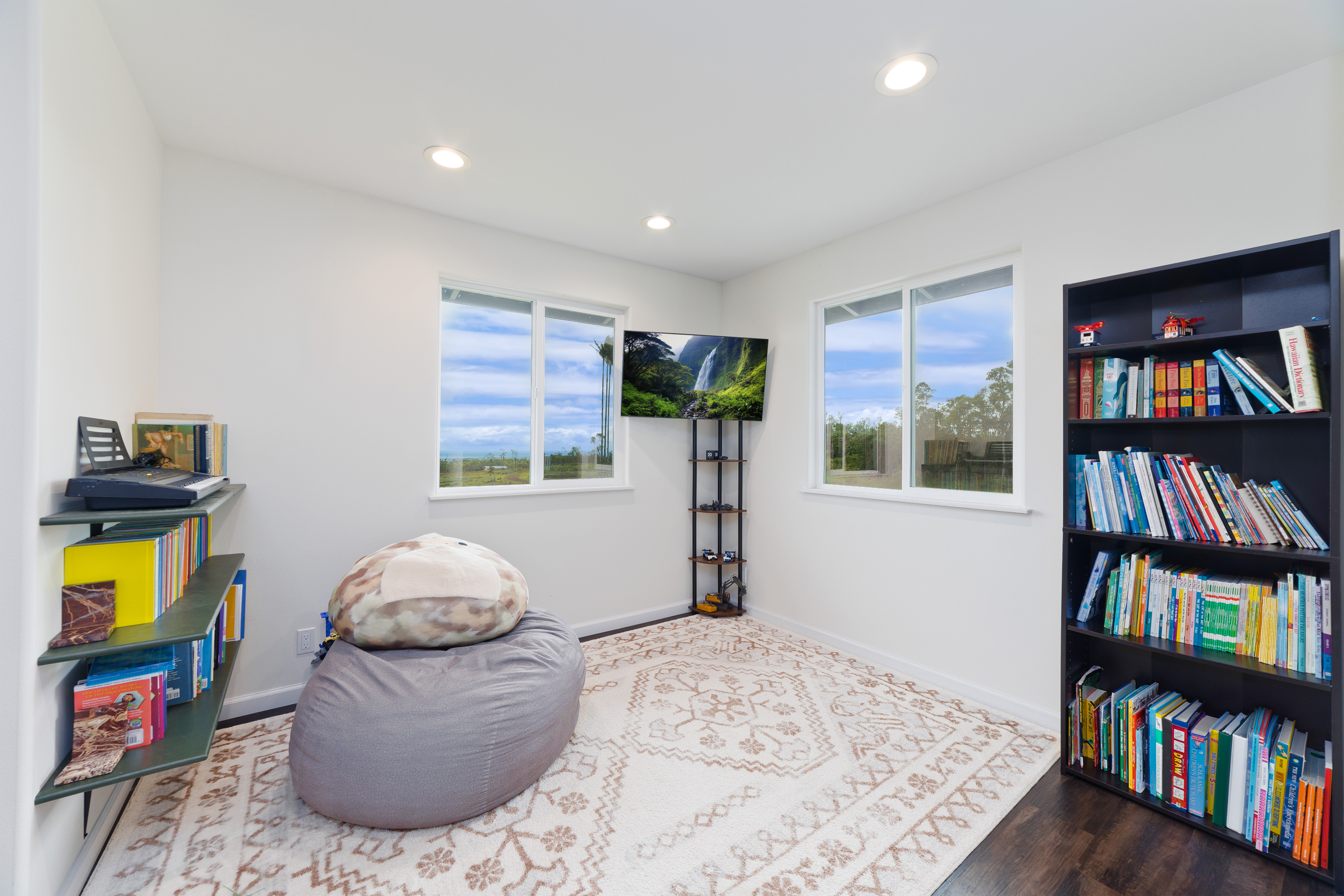 18-7970 North Lauko Road Mountain View, HI 96771 - Photo 16 of 30 a living room with furniture and a book shelf