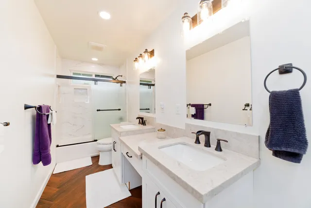 a view of a backyard with large trees