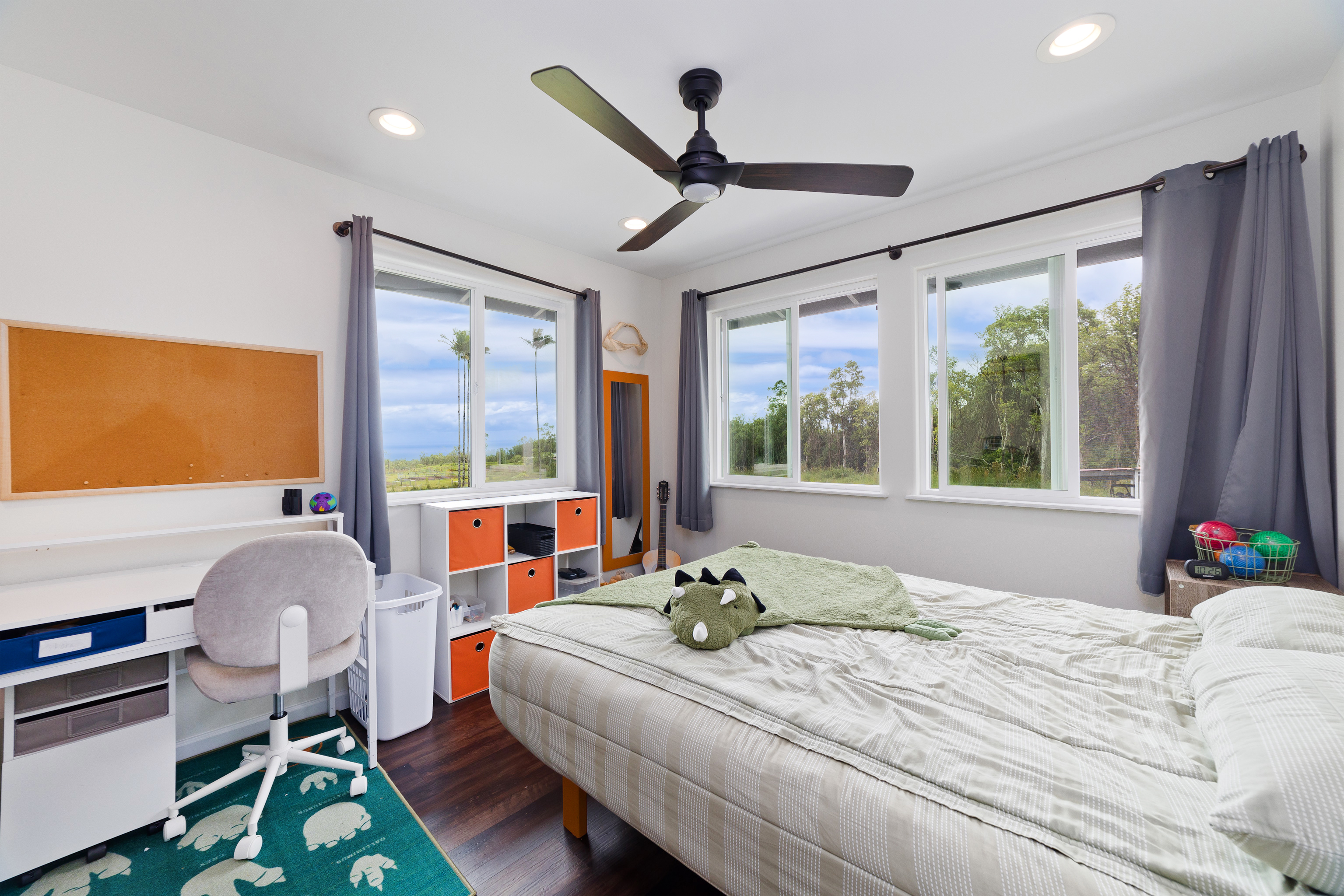 18-7970 North Lauko Road Mountain View, HI 96771 - Photo 19 of 30 a bedroom with a bed and a large window