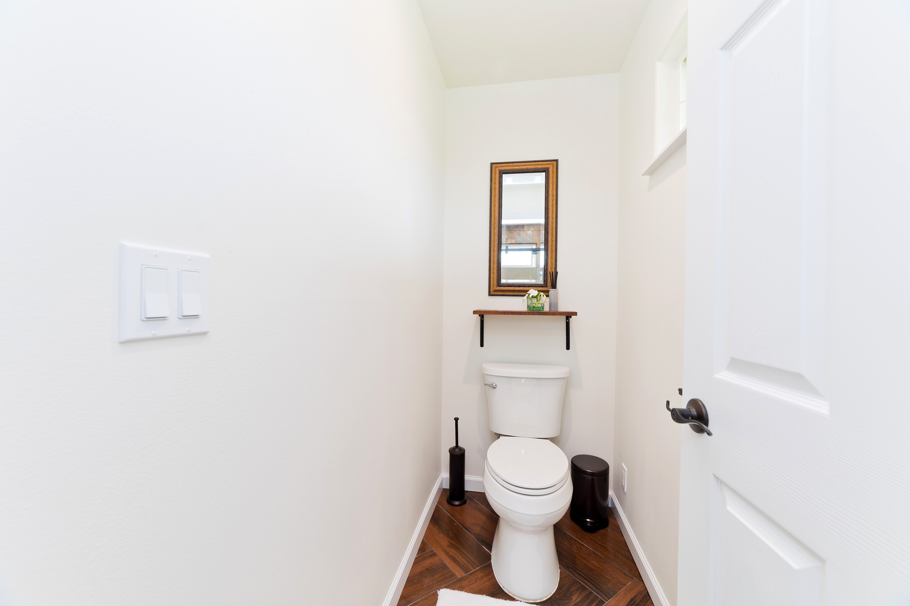 18-7970 North Lauko Road Mountain View, HI 96771 - Photo 24 of 30 a white toilet sitting next to a bathroom sink