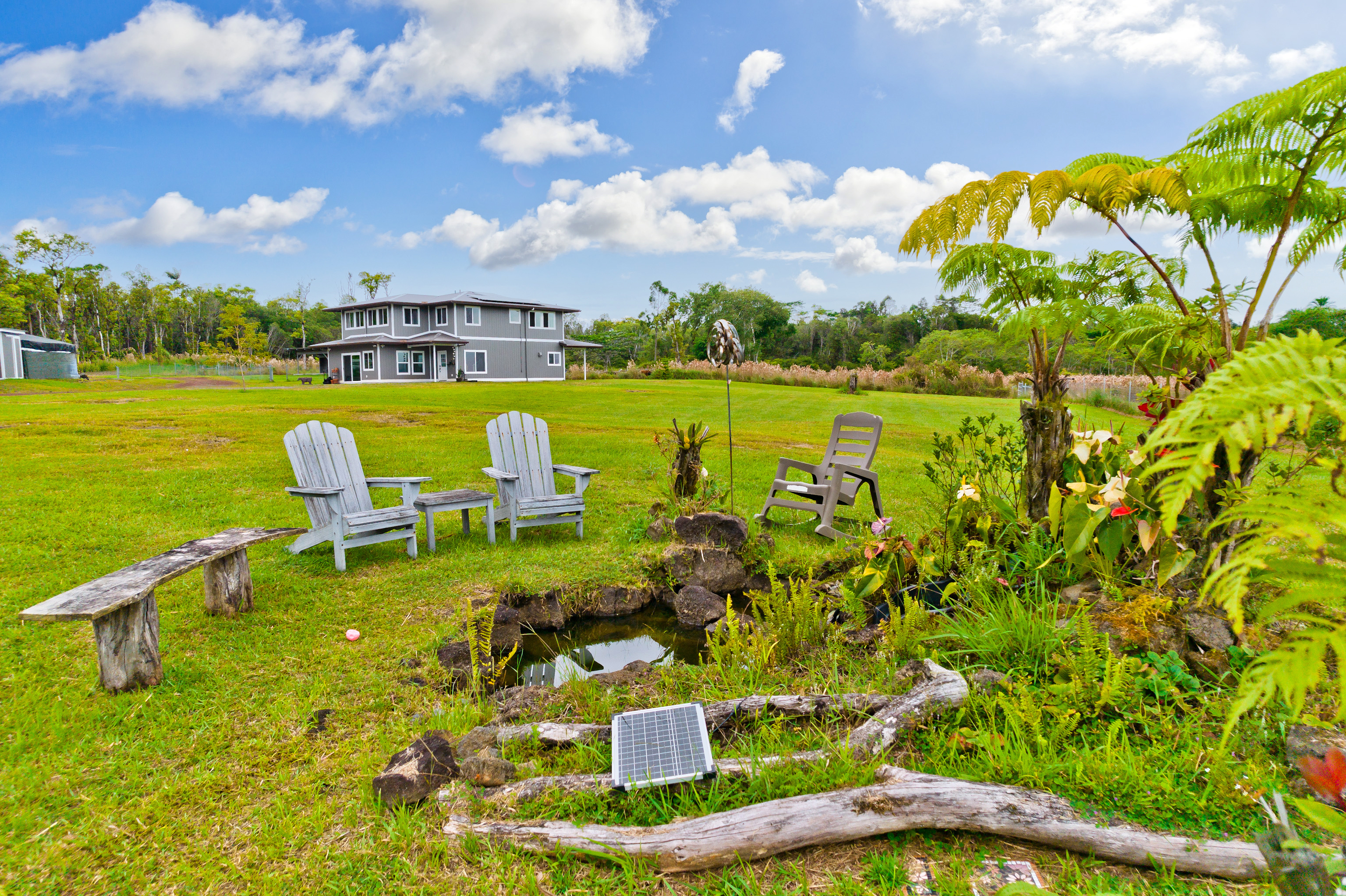 18-7970 North Lauko Road Mountain View, HI 96771 - Photo 3 of 30 a swimming pool with outdoor seating and yard