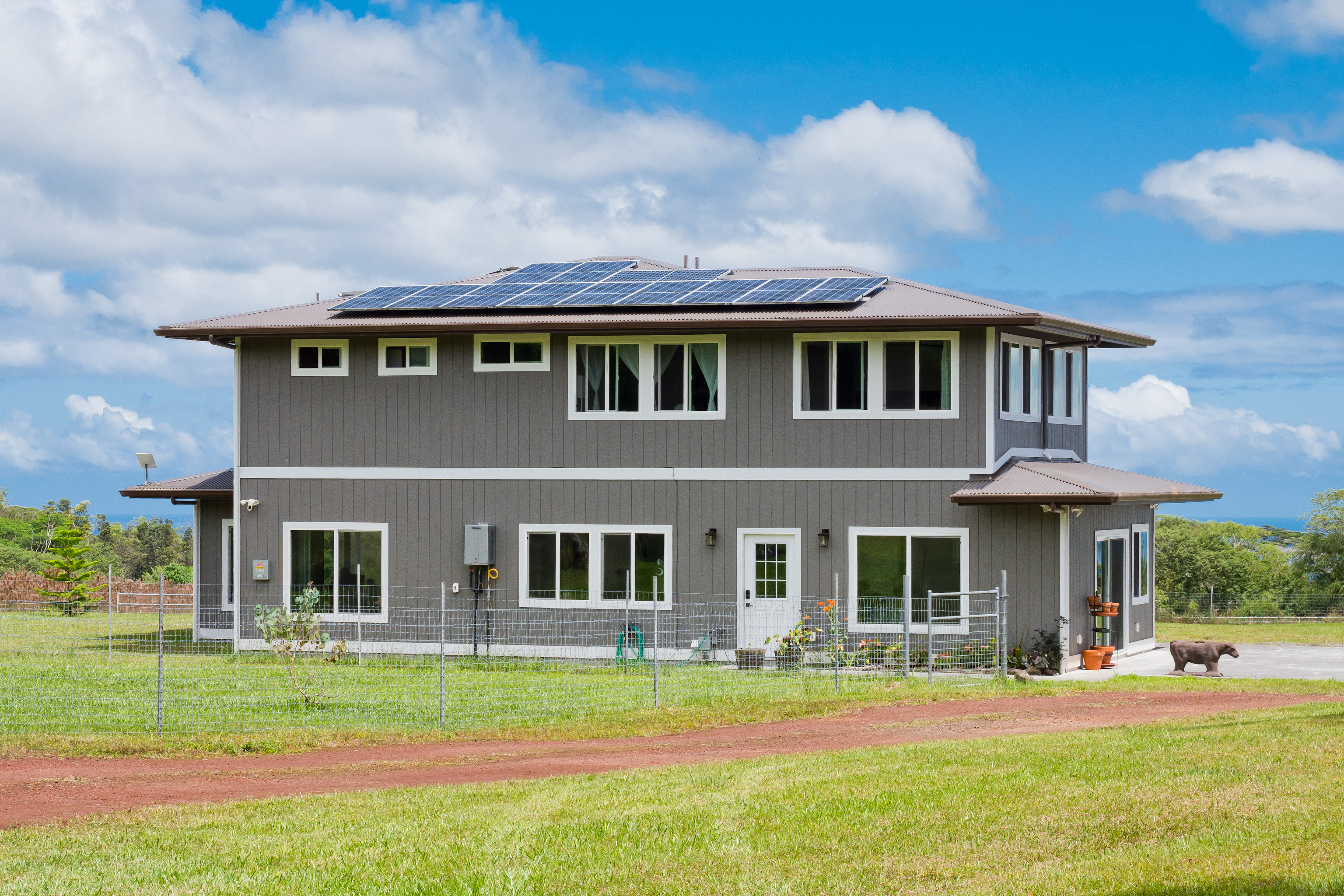 18-7970 North Lauko Road Mountain View, HI 96771 - Photo 4 of 30 a front view of a house with a yard