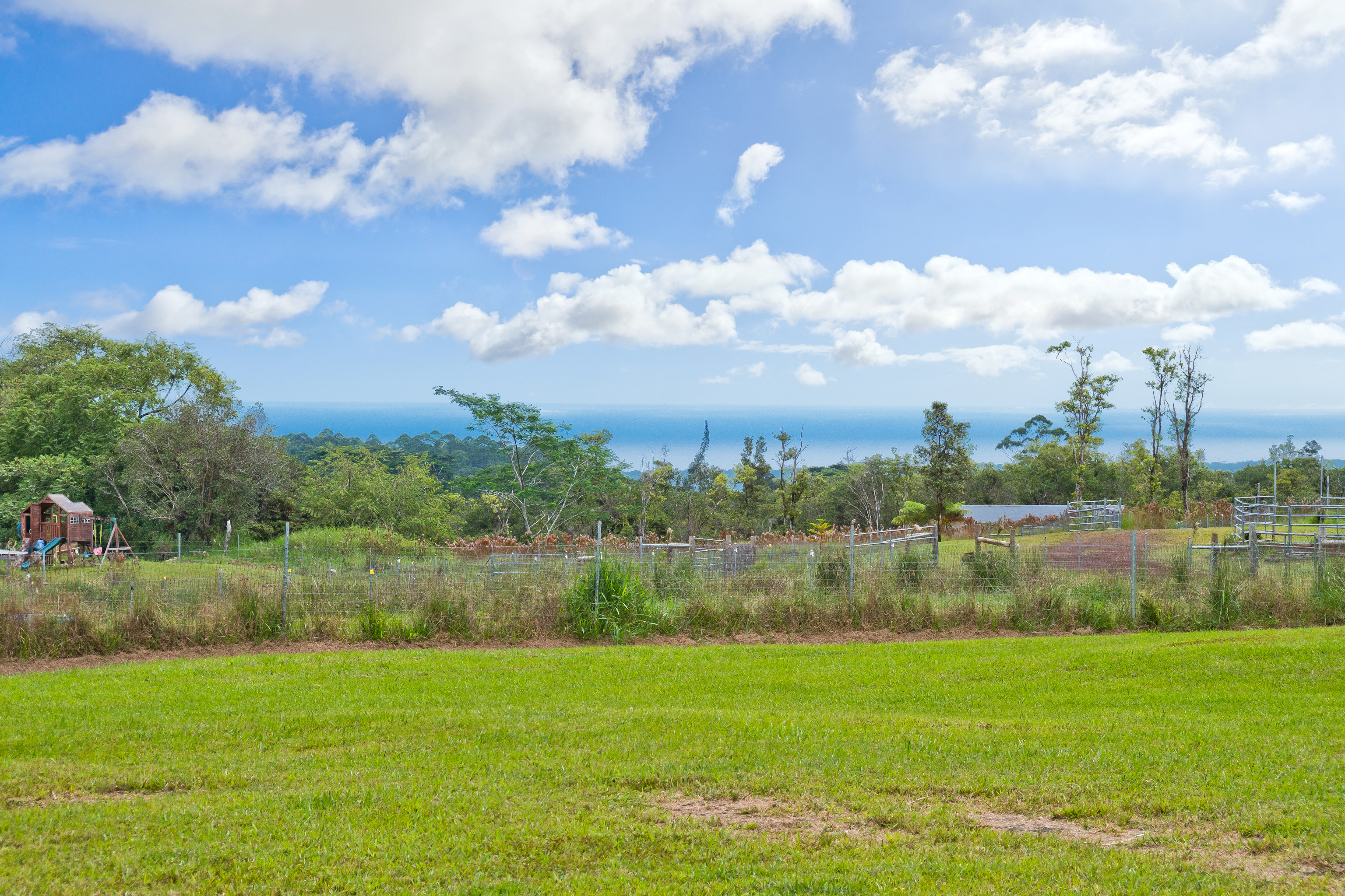18-7970 North Lauko Road Mountain View, HI 96771 - Photo 5 of 30 a view of a lake with a yard