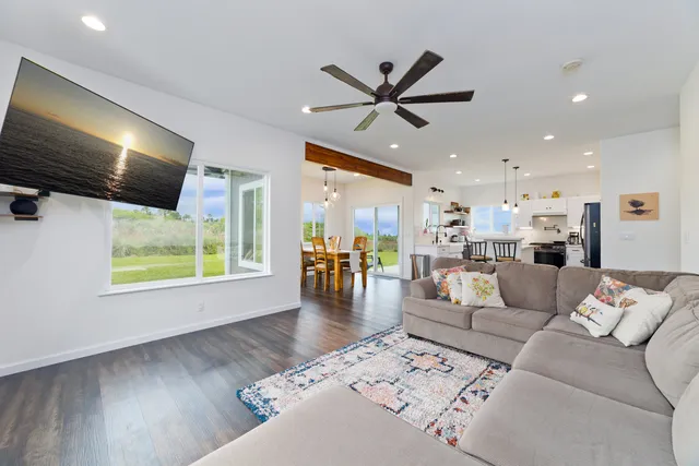 a view of a hallway with wooden floor windows and livingroom view