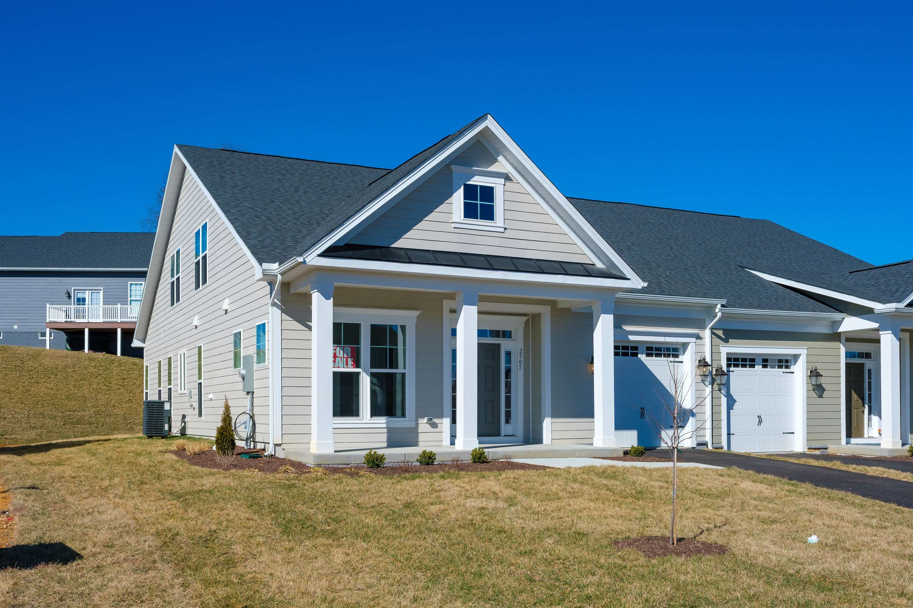 2905 Rutlege Road Harrisonburg, VA 22801 - Photo 1 of 24 a view of a white house with large windows and a yard