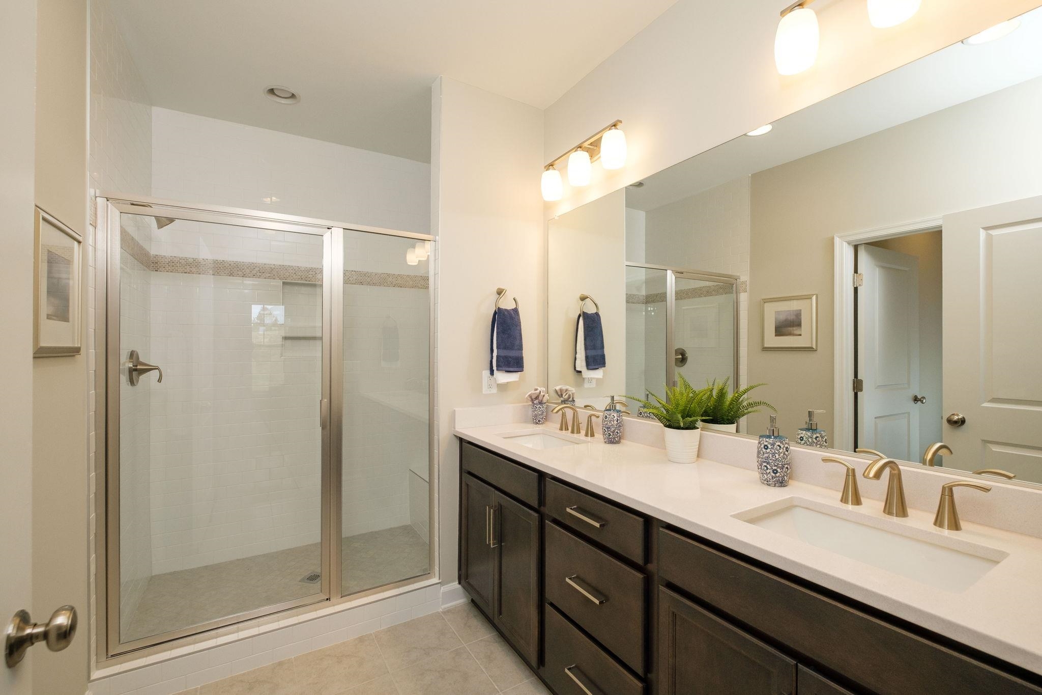 2905 Rutlege Road Harrisonburg, VA 22801 - Photo 15 of 24 a bathroom with a double vanity sink mirror and shower