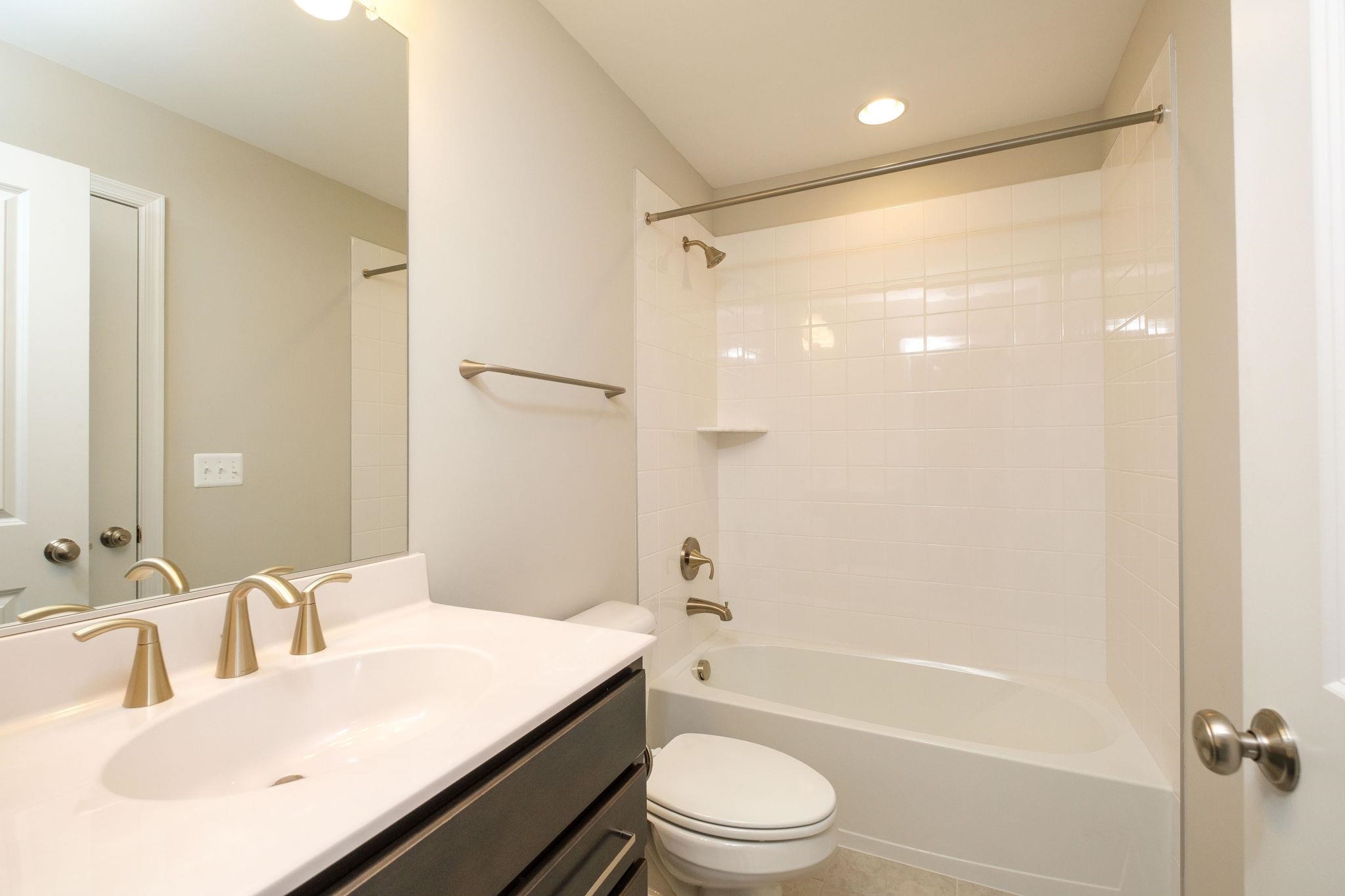 2905 Rutlege Road Harrisonburg, VA 22801 - Photo 17 of 24 a bathroom with a granite countertop sink toilet and shower