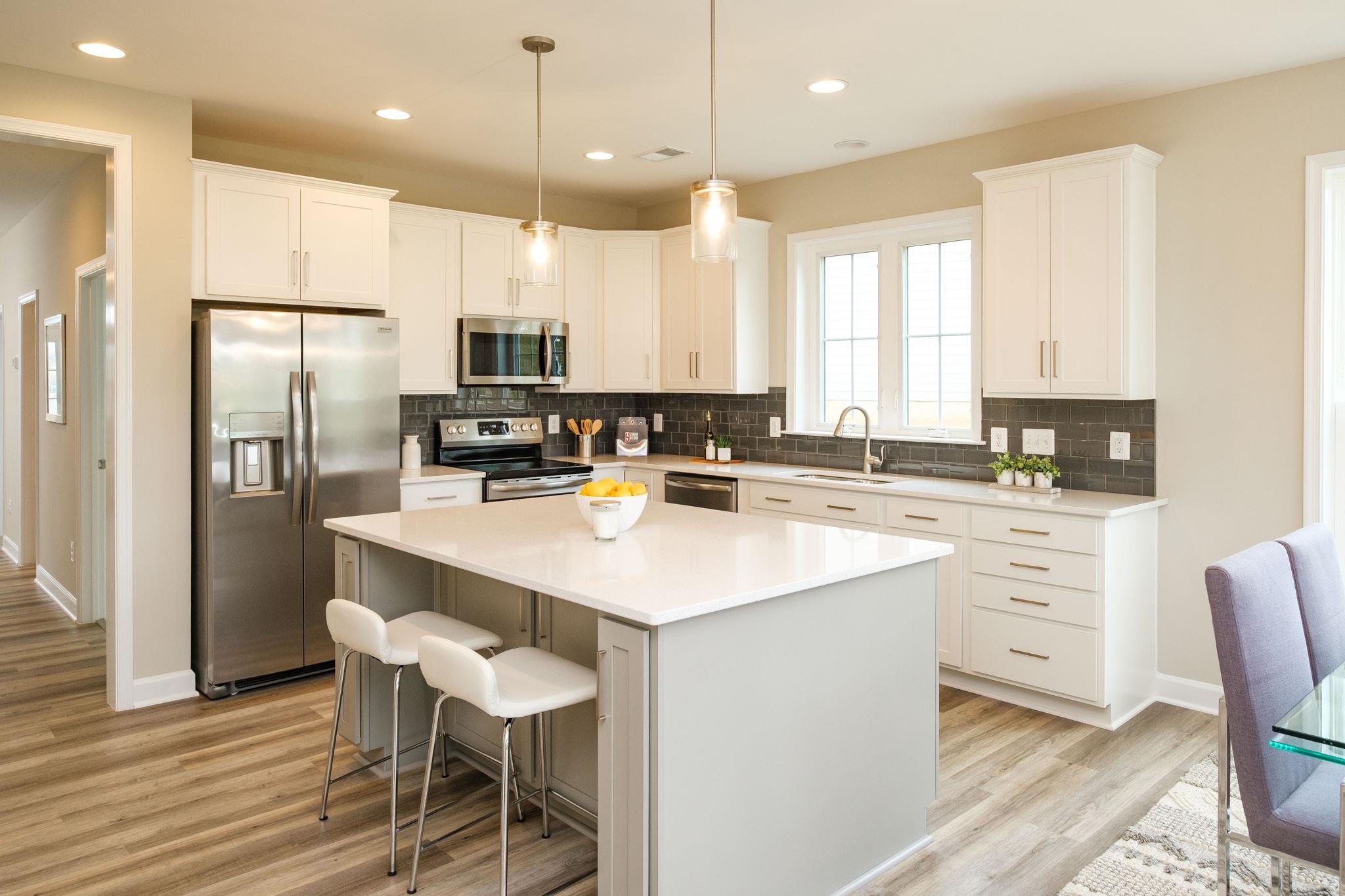 2905 Rutlege Road Harrisonburg, VA 22801 - Photo 5 of 24 a kitchen with kitchen island white cabinets and stainless steel appliances