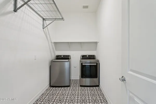 a kitchen with a stove and a refrigerator