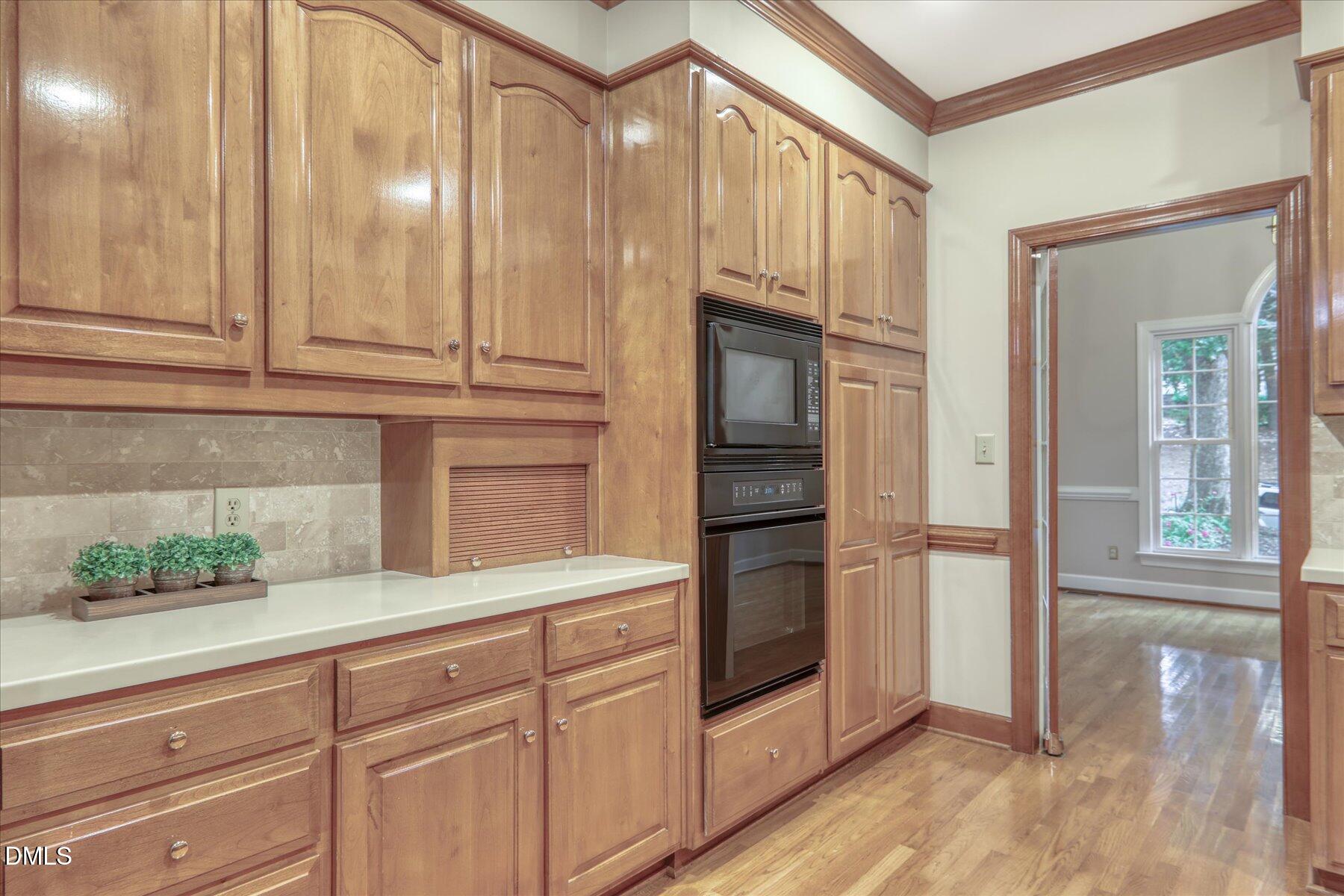 1904 Merion Place Raleigh, NC 27615 - Photo 12 of 43 Custom cabinets with wall microwave and oven