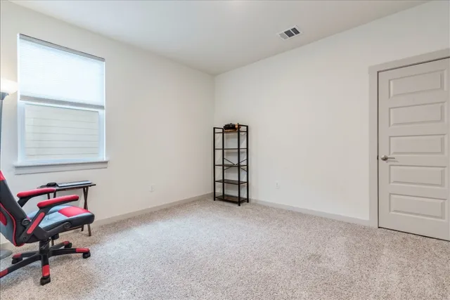 a bedroom with a bed and a cabinets