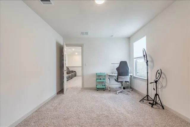 a view of room with gym equipment