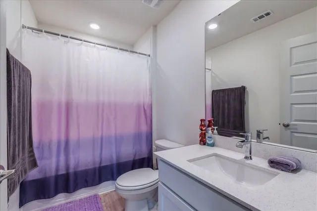 a room with gym equipment and a view of living room