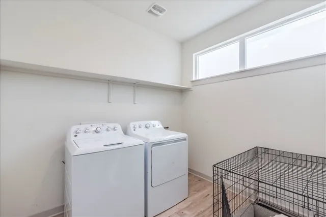 a bathroom with a sink a toilet and shower curtain