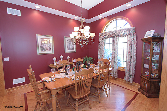 8001 East Tryon Grove Road Richmond, IL 60071 - Photo 3 of 24 a view of a dining room with furniture a chandelier and wooden floor