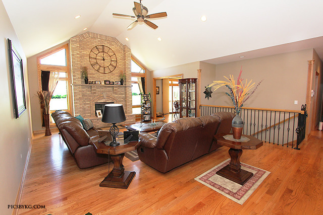 8001 East Tryon Grove Road Richmond, IL 60071 - Photo 4 of 24 a living room with furniture windows and a chandelier
