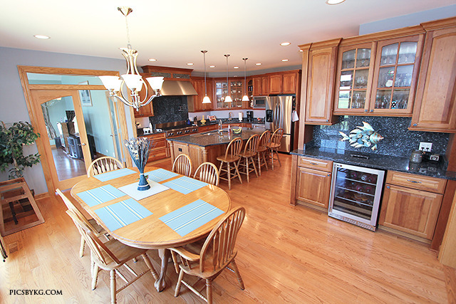 8001 East Tryon Grove Road Richmond, IL 60071 - Photo 8 of 24 a view of a dining room with furniture window and wooden floor