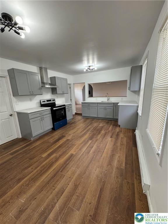 1232 South 9th Street, Unit REAR Allentown, PA 18103 - Photo 4 of 11 a kitchen with a sink dishwasher a stove and a microwave oven with cabinets