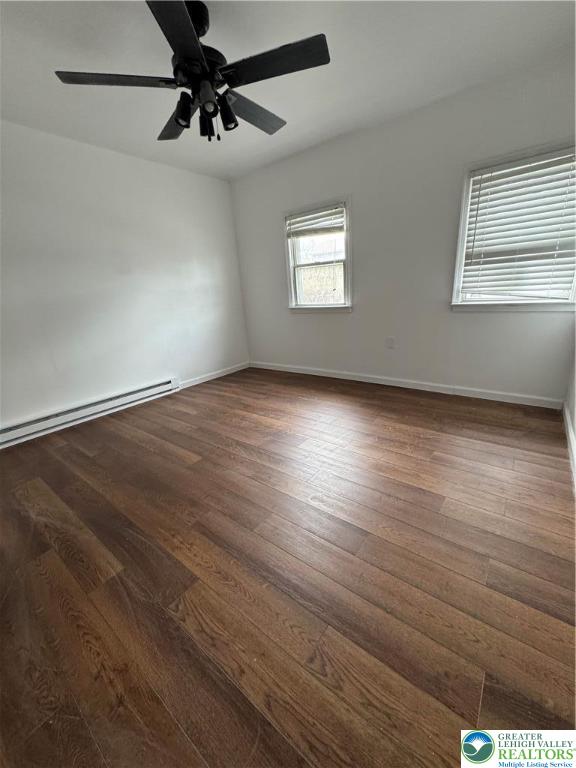 1232 South 9th Street, Unit REAR Allentown, PA 18103 - Photo 10 of 11 a view of an empty room with wooden floor and a window