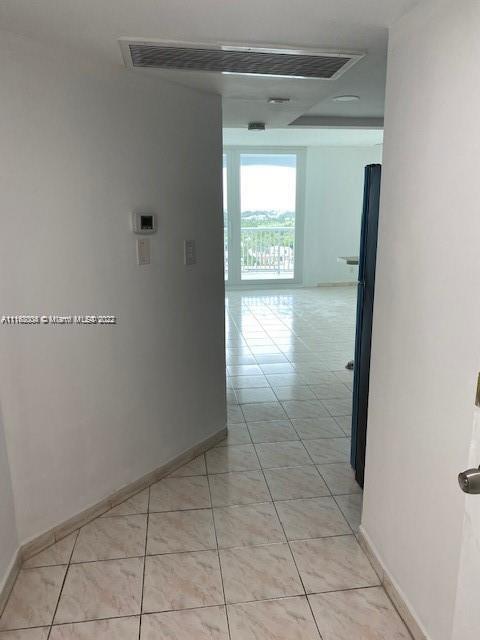5401 Collins Avenue, Unit 833 Miami Beach, FL 33140 - Photo 18 of 25 a view of hallway with window