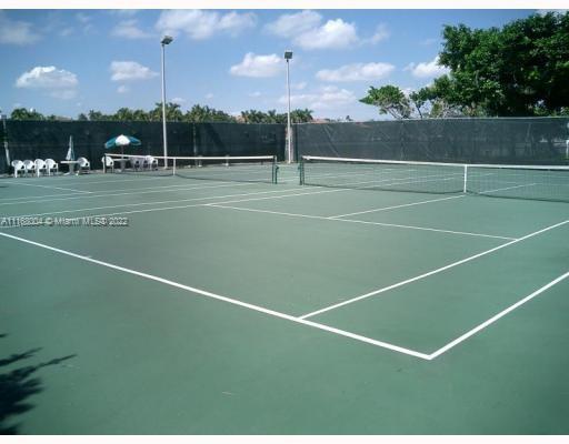 5401 Collins Avenue, Unit 833 Miami Beach, FL 33140 - Photo 23 of 25 a view of an tennis court