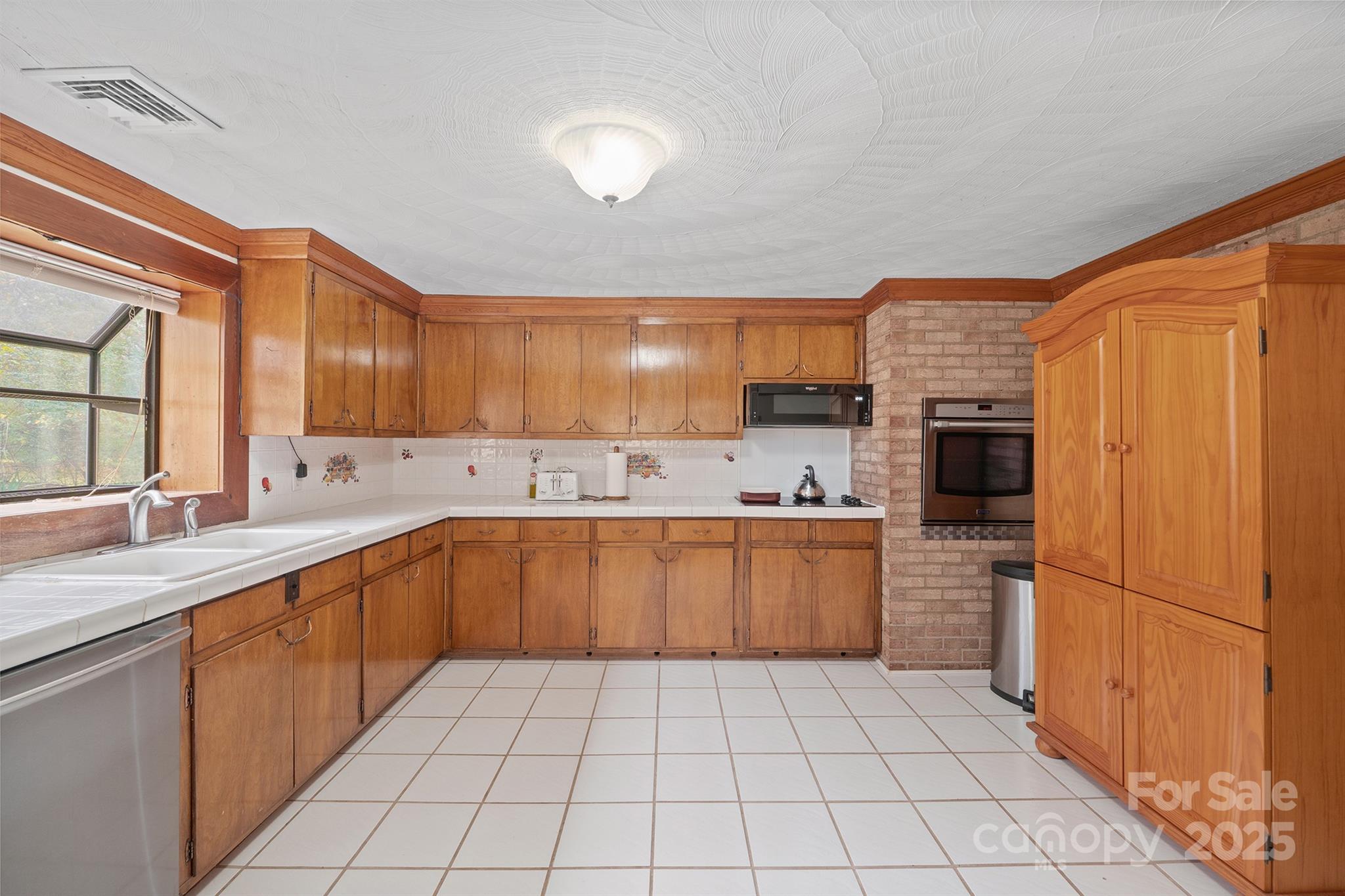 5260 Rifle Range Road Conover, NC 28613 - Photo 15 of 27 a kitchen with stainless steel appliances granite countertop a refrigerator and a sink