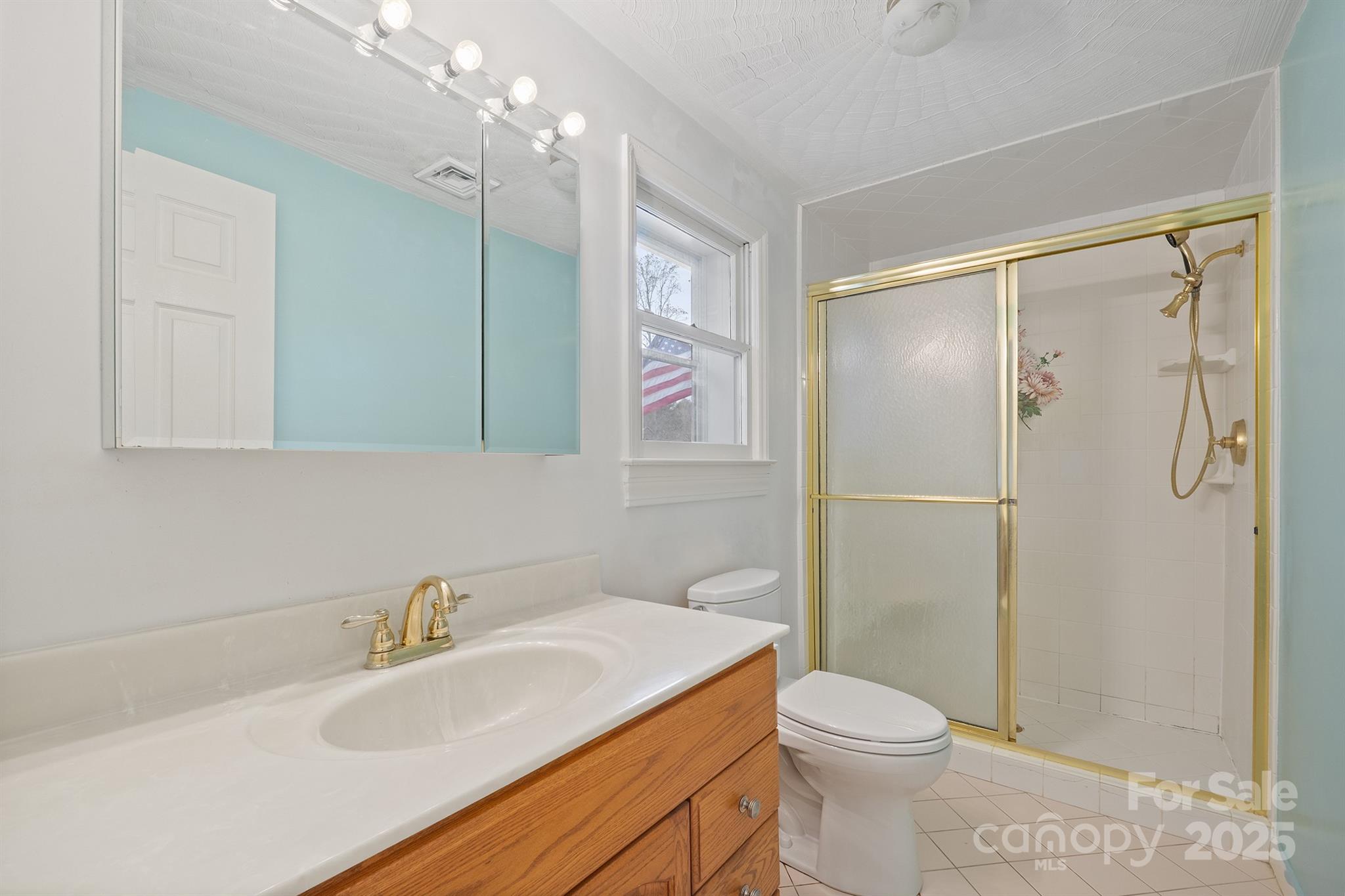 5260 Rifle Range Road Conover, NC 28613 - Photo 22 of 27 a bathroom with a sink toilet and shower