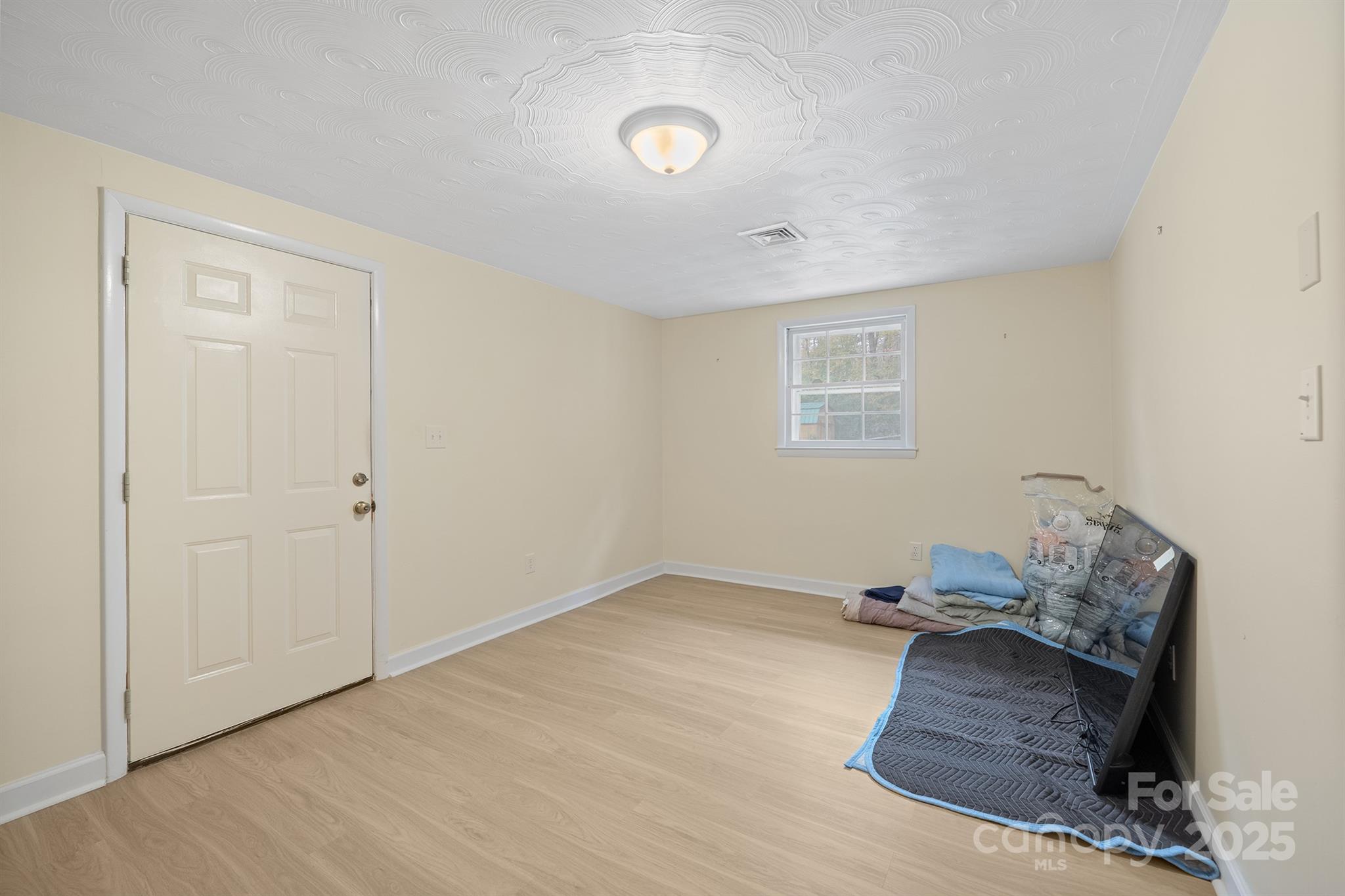 5260 Rifle Range Road Conover, NC 28613 - Photo 25 of 27 a room with furniture and a window