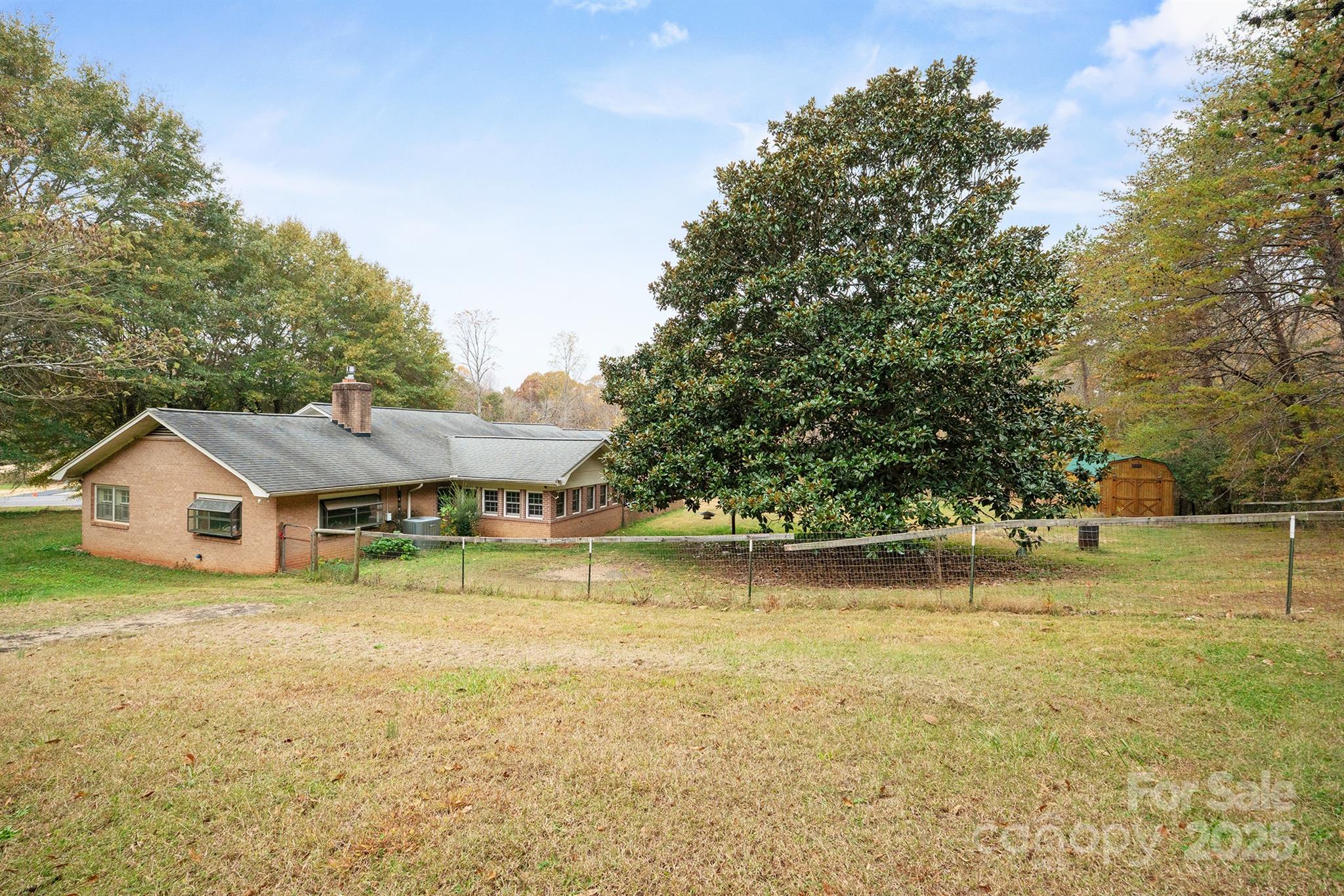 5260 Rifle Range Road Conover, NC 28613 - Photo 3 of 27 a view of a house with a big yard and large trees