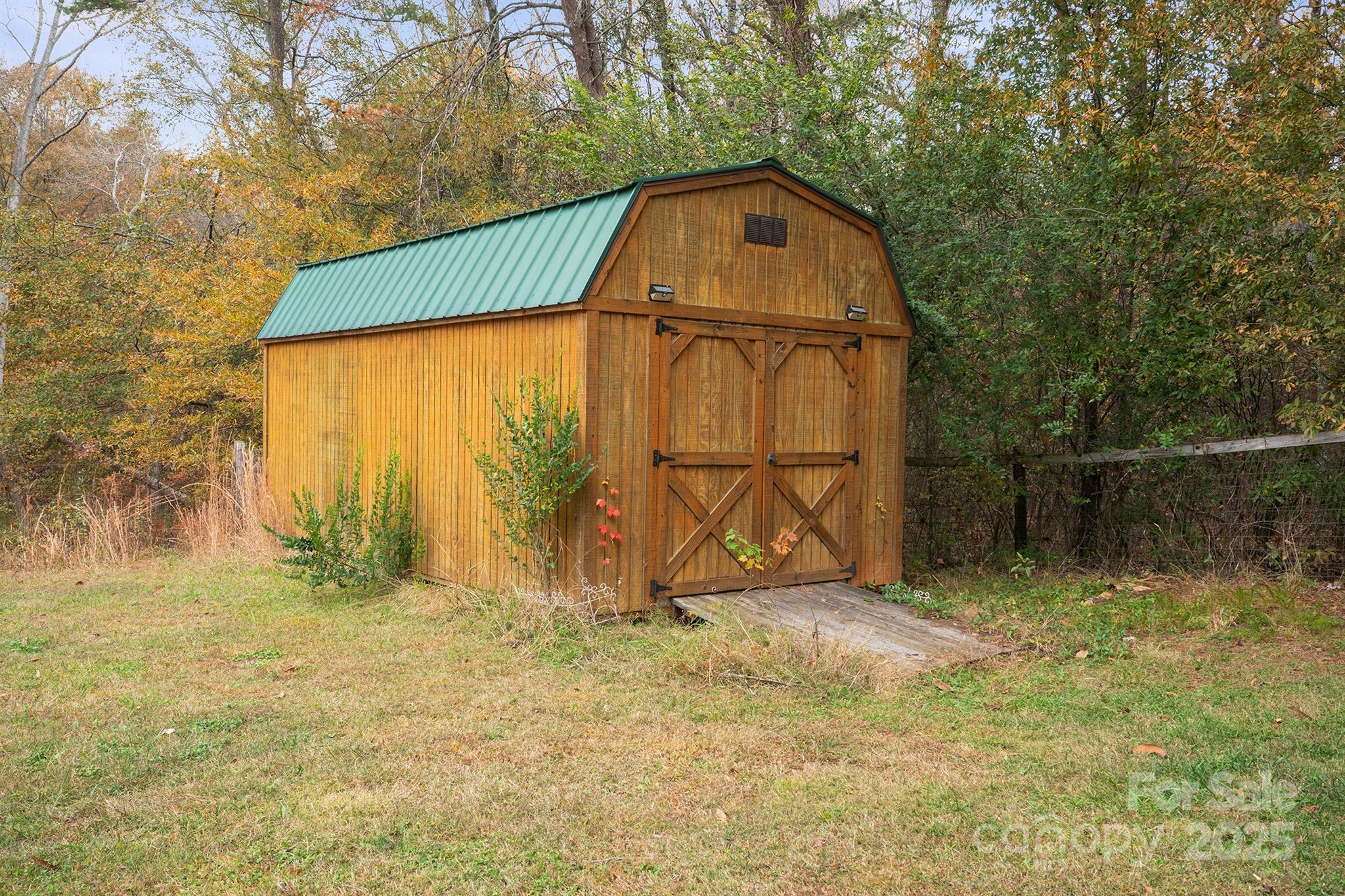 5260 Rifle Range Road Conover, NC 28613 - Photo 4 of 27 a view of a wooden house with a yard