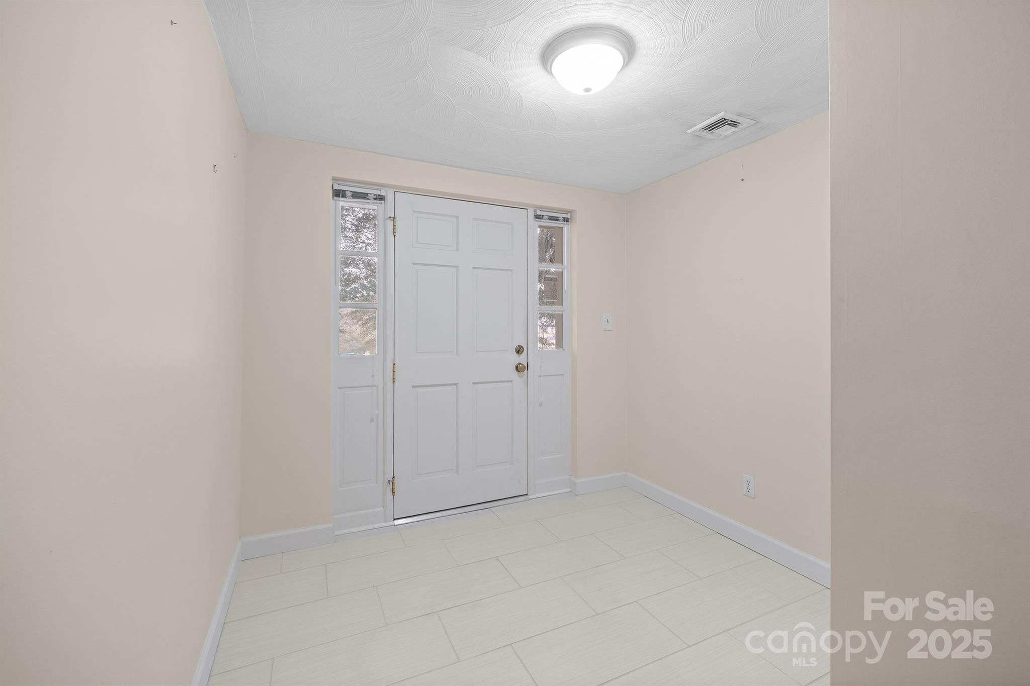 5260 Rifle Range Road Conover, NC 28613 - Photo 6 of 27 an empty room with white walls