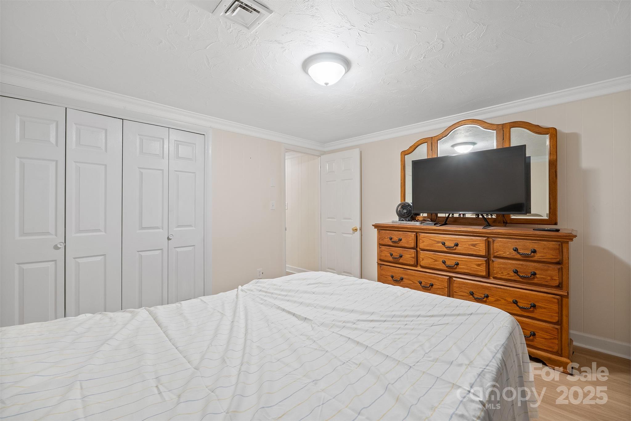 5260 Rifle Range Road Conover, NC 28613 - Photo 10 of 27 a bedroom with a bed and a flat screen tv