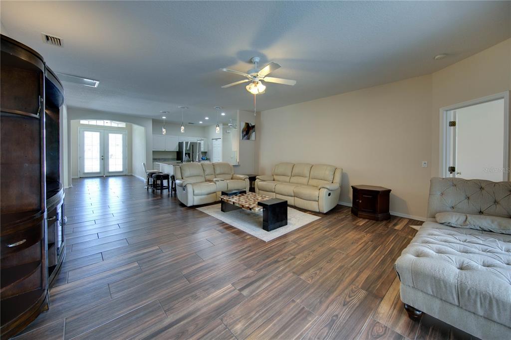 5291 Echo Lane Sarasota, FL 34233 - Photo 13 of 32 a living room with furniture and a chandelier