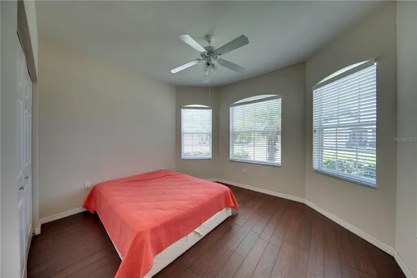 a bedroom with a bed and window