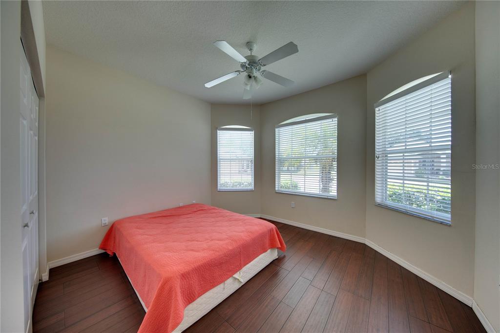 5291 Echo Lane Sarasota, FL 34233 - Photo 20 of 32 a bedroom with a bed and window